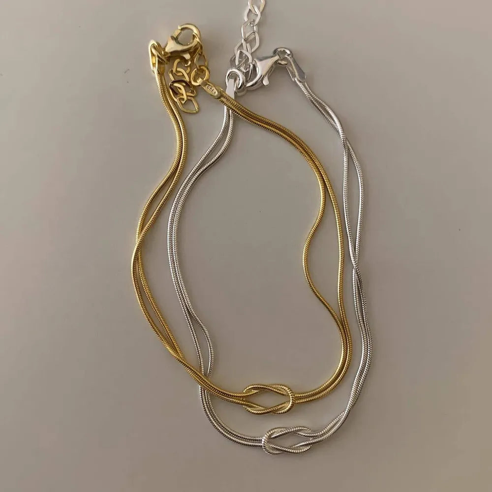 14,46 USD - Collier noué en acier titane