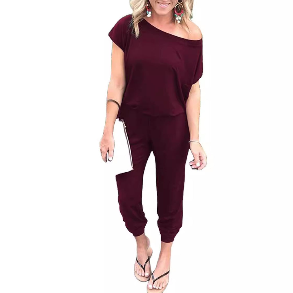 Combinaison femme tendance à épaules asymétriques, manches courtes et poches, disponible en 6 couleurs