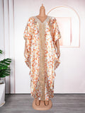 Robe africaine à motif patchwork et imprimé, avec col en V et perles