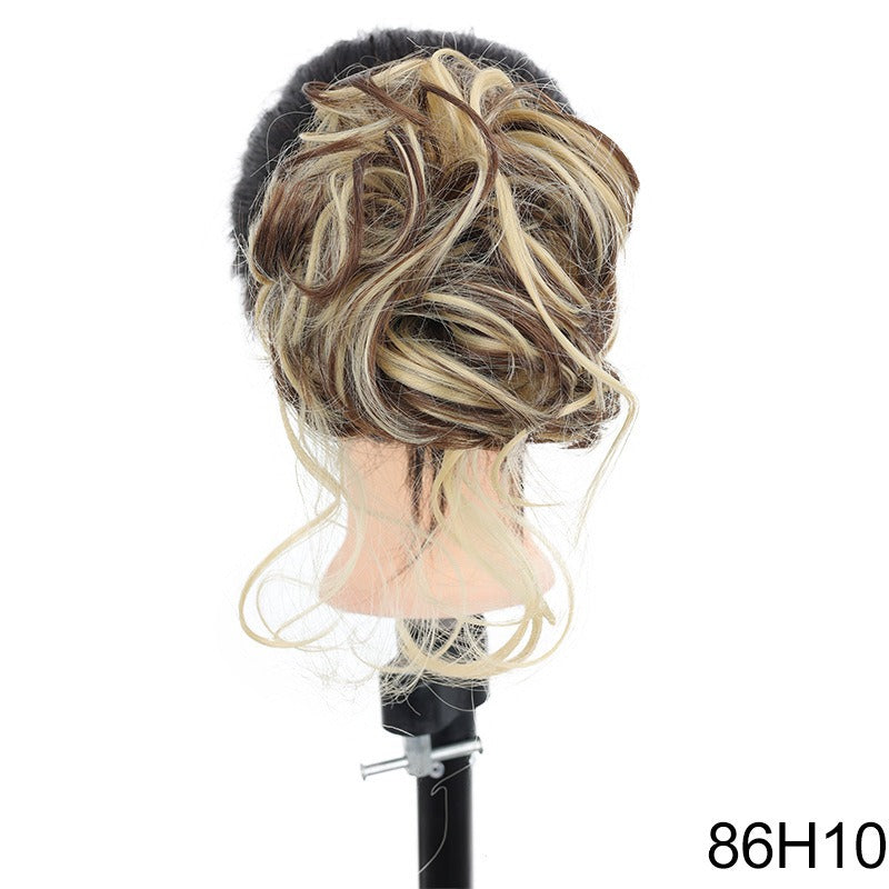 Chignon synthétique bouclé et ébouriffé sur pince (type « claw clip ») avec mèches pendantes – Postiche pour femme