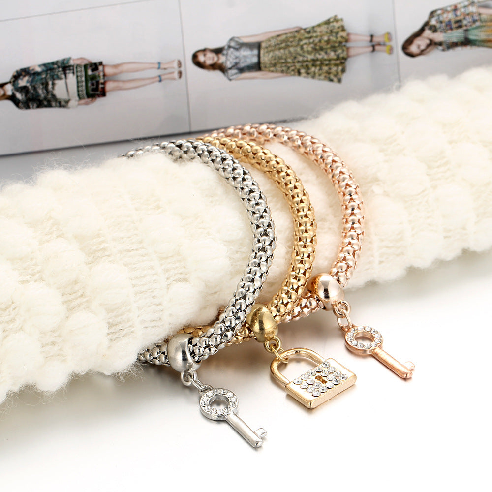 14.05 USD - European and American alloy elastic bracelet, adorned with crystals and diamonds, with a key clasp. Trendy and creative hand jewelry.