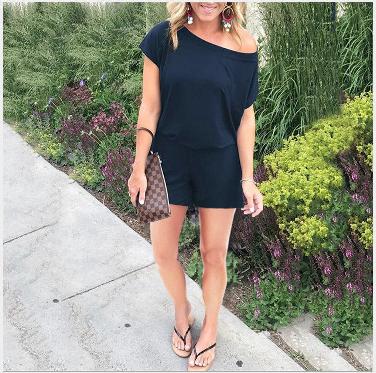 Combinaison femme tendance à épaules asymétriques, manches courtes et poches, disponible en 6 couleurs