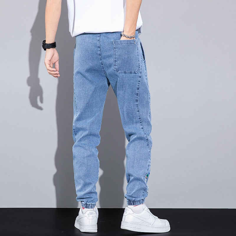 44.24 USD Jean cargo/jogging Harlan gris, coupe ample, broderie texte, taille élastique, collection printemps-été. Tailles M à 8XL.