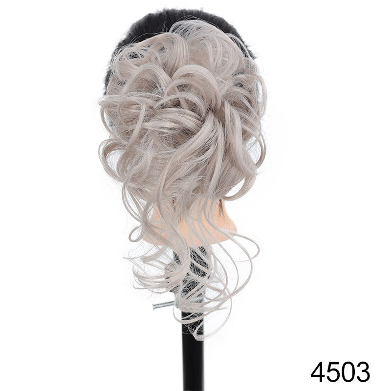 Chignon synthétique bouclé et ébouriffé sur pince (type « claw clip ») avec mèches pendantes – Postiche pour femme