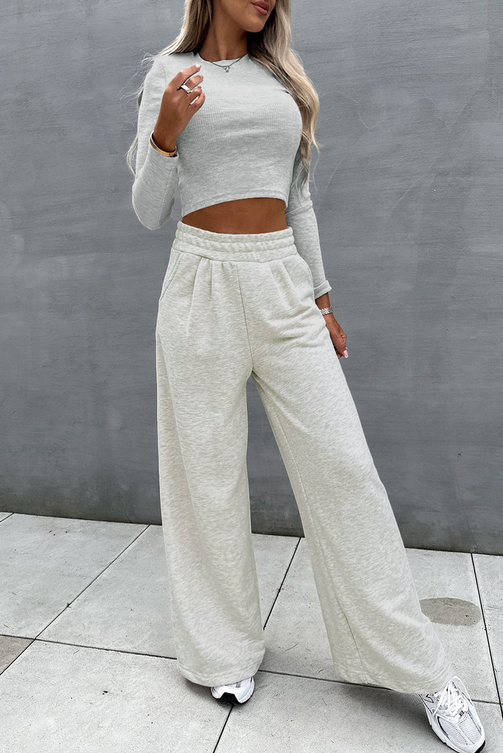 Two-piece set consisting of a black crop top and wide-leg trousers