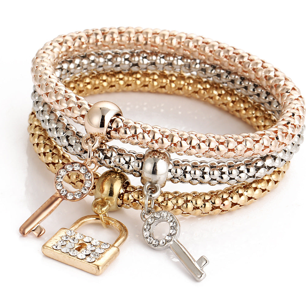 14.05 USD - European and American alloy elastic bracelet, adorned with crystals and diamonds, with a key clasp. Trendy and creative hand jewelry.
