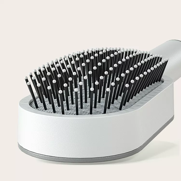 Peigne à coussin d'air amélioré avec système de pression pour un nettoyage facile, idéal pour les cheveux longs des femmes. Peigne de massage avec coussin d'air.