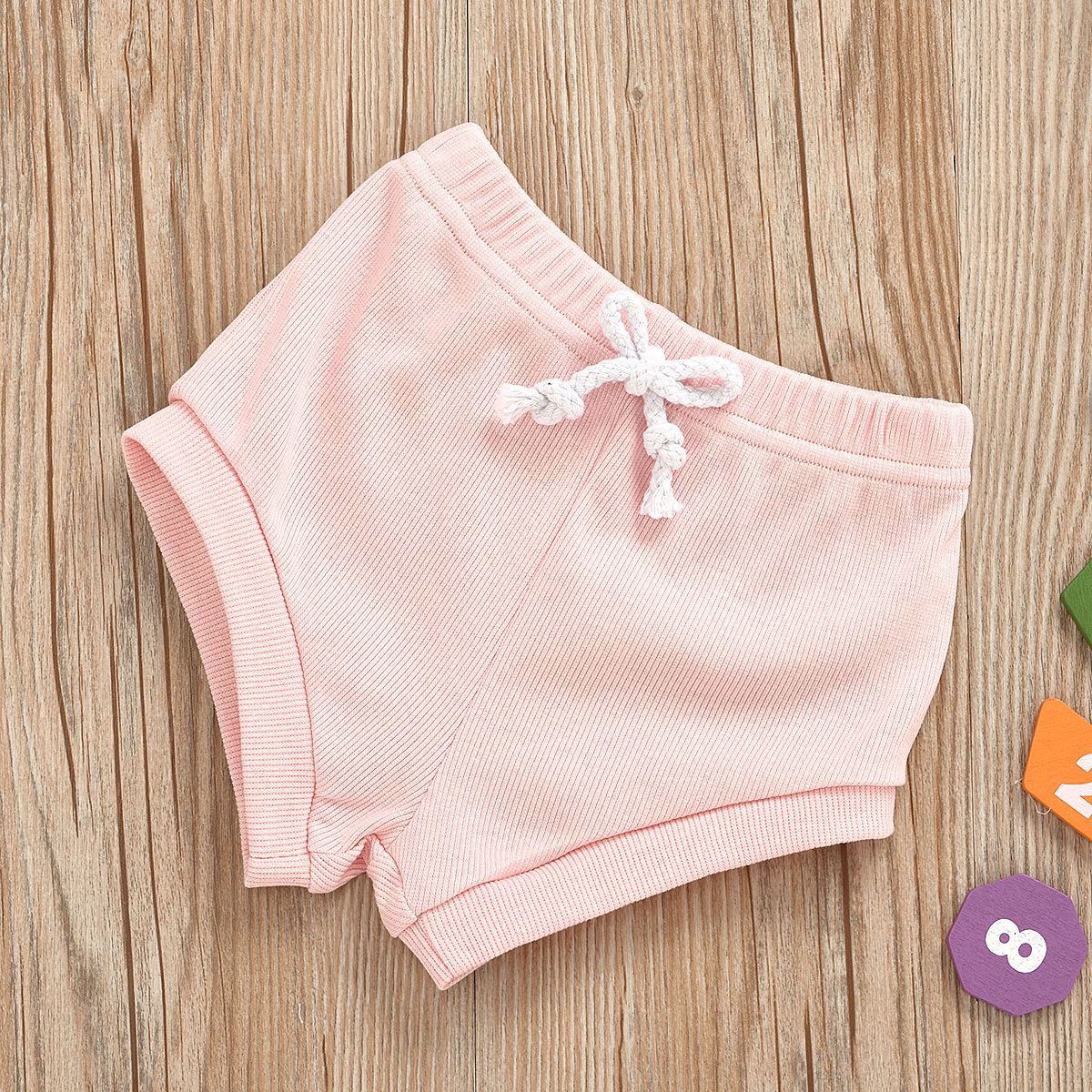 13.97 USD Ensemble 2 pièces pour bébé fille (1-3 ans) : haut et short sans manches en coton biologique uni.