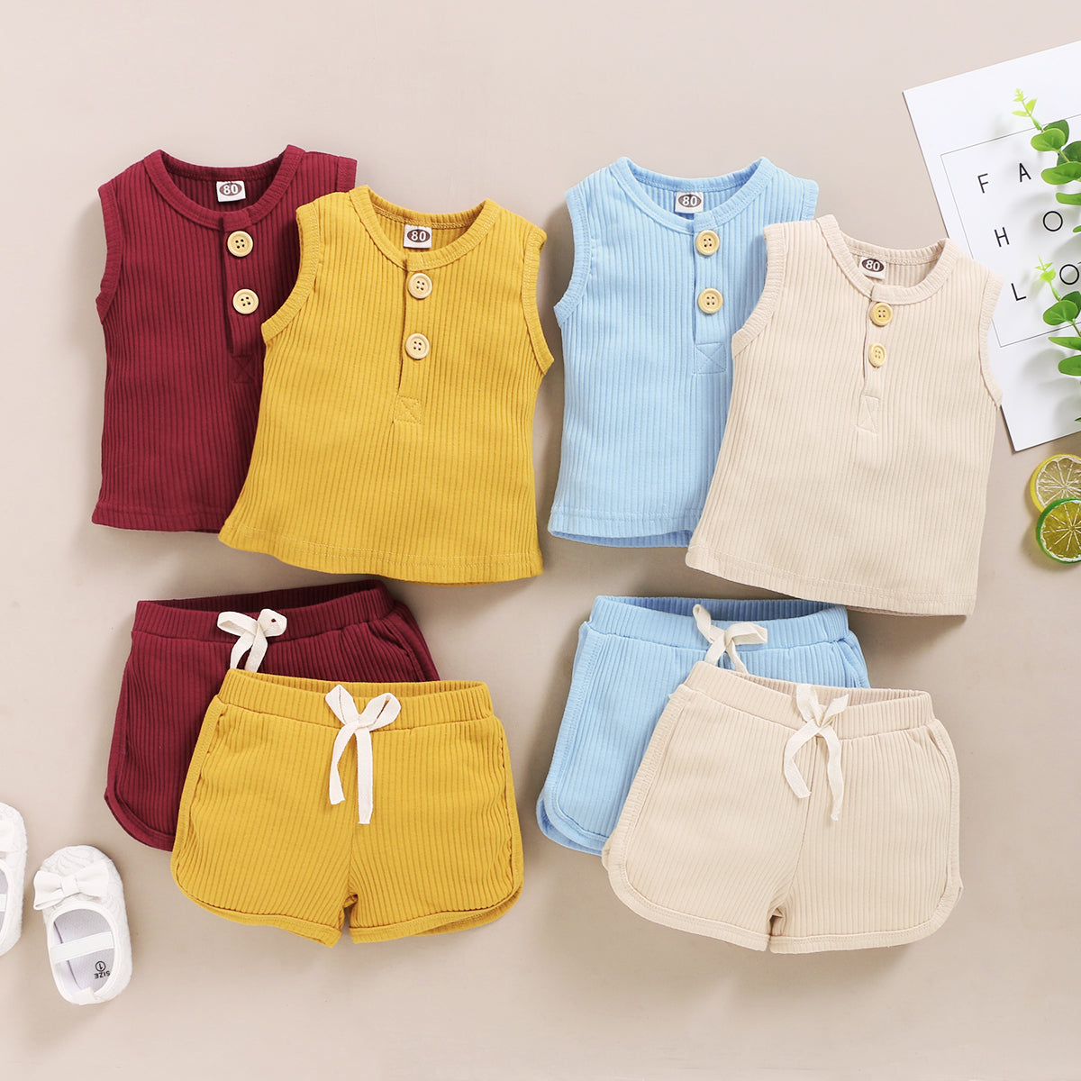 15.13 USD Ensemble de vêtements pour bébés garçons et filles, débardeur sans manches à boutons et short assortis.