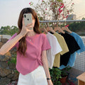 Women's asymmetrical short-sleeved high-waisted crop top, ideal for summer.