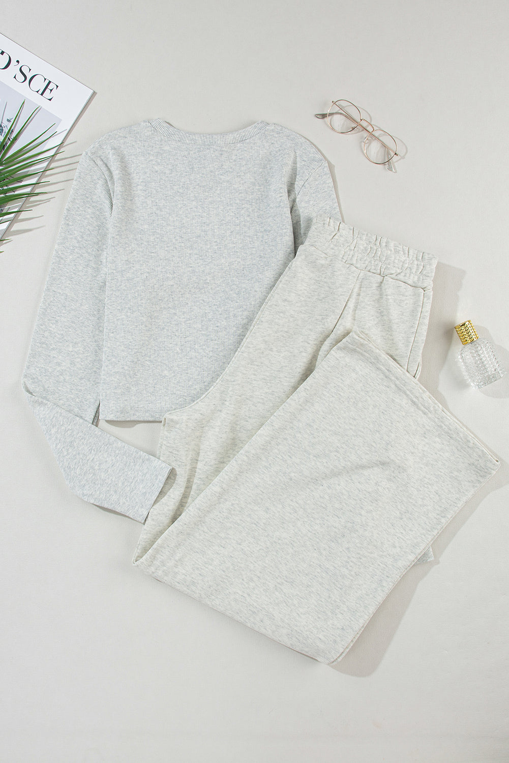 Two-piece set consisting of a black crop top and wide-leg trousers