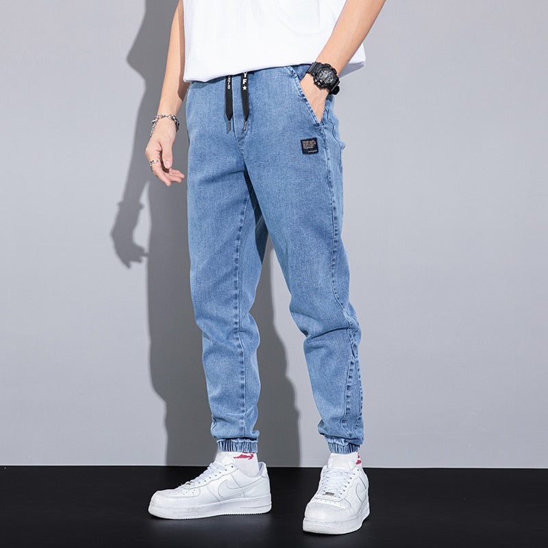 44.24 USD Jean cargo/jogging Harlan gris, coupe ample, broderie texte, taille élastique, collection printemps-été. Tailles M à 8XL.