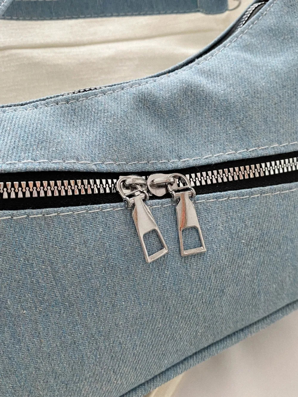 Denim crossbody bag with zipper closure