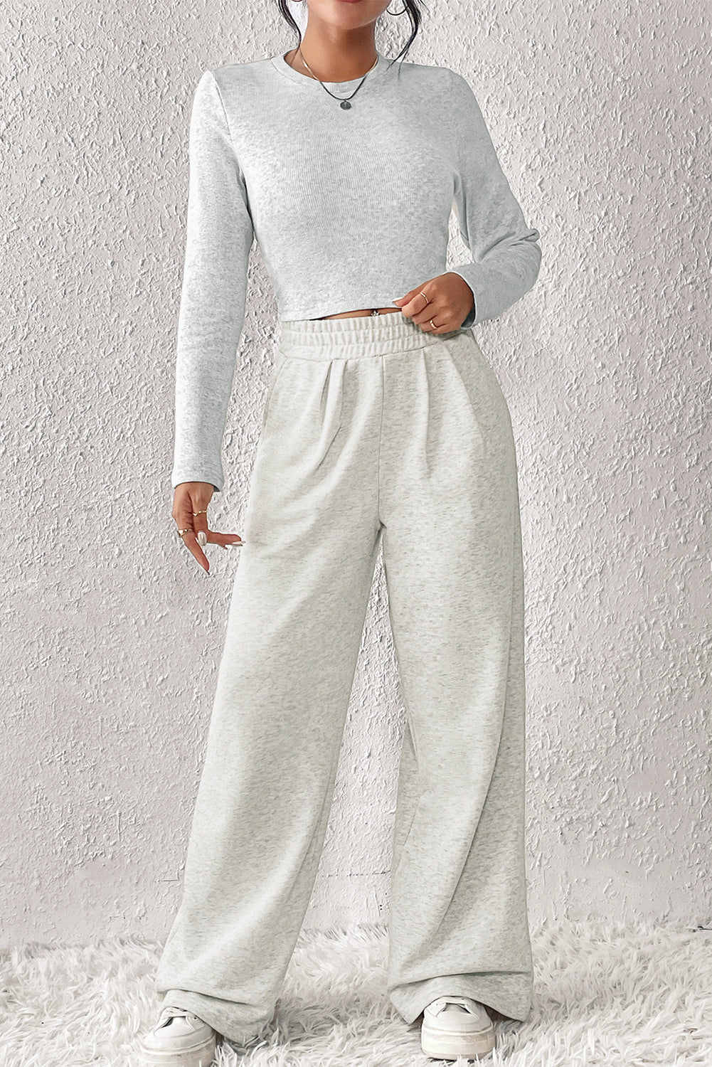 Two-piece set consisting of a black crop top and wide-leg trousers