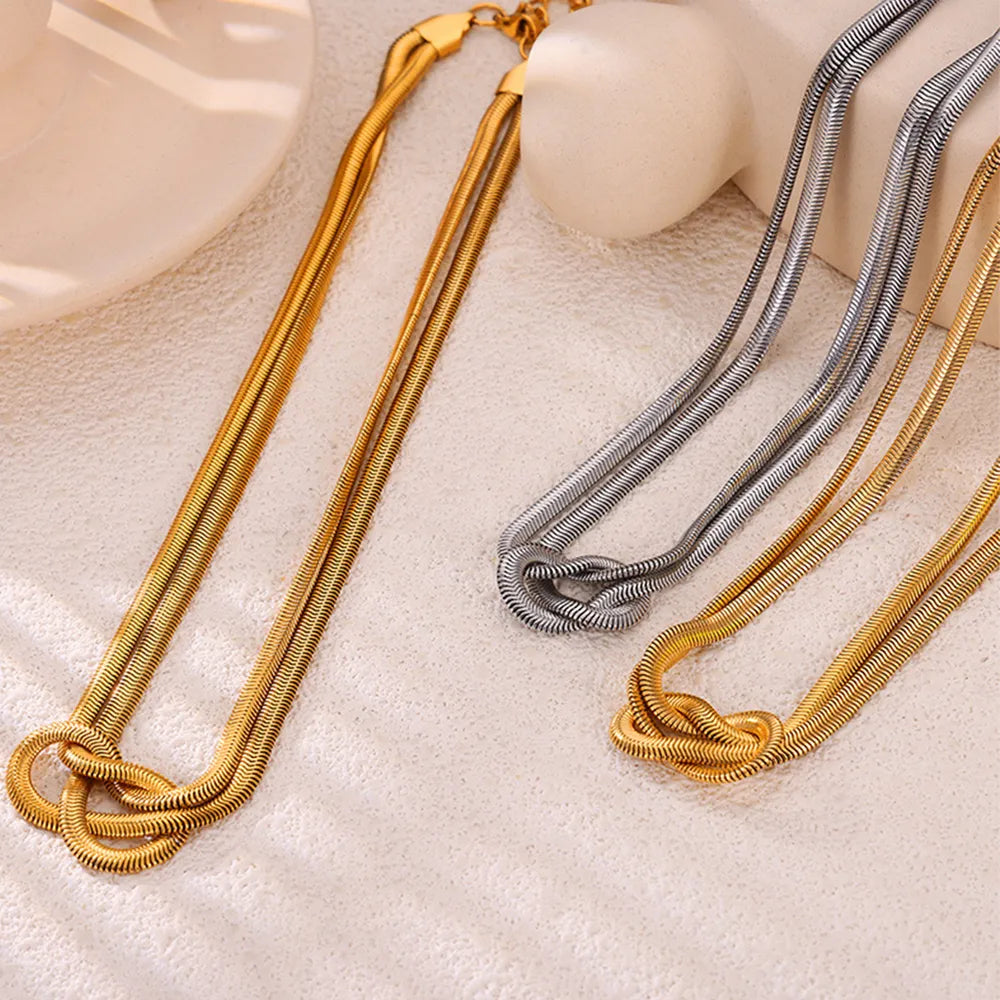 17,70 USD - Collier nœud en acier titane
