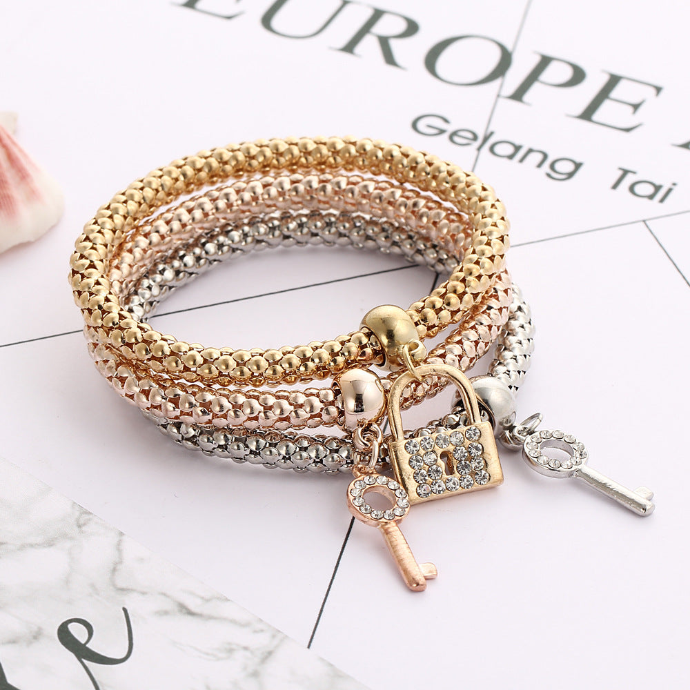 14.05 USD - European and American alloy elastic bracelet, adorned with crystals and diamonds, with a key clasp. Trendy and creative hand jewelry.