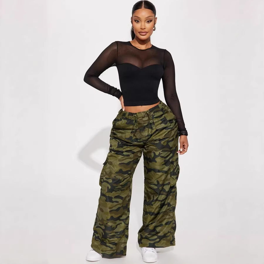 Chic long-sleeved crop top for women with mesh inserts, ideal for spring and summer. A versatile, sexy, and casual crop top for girls.