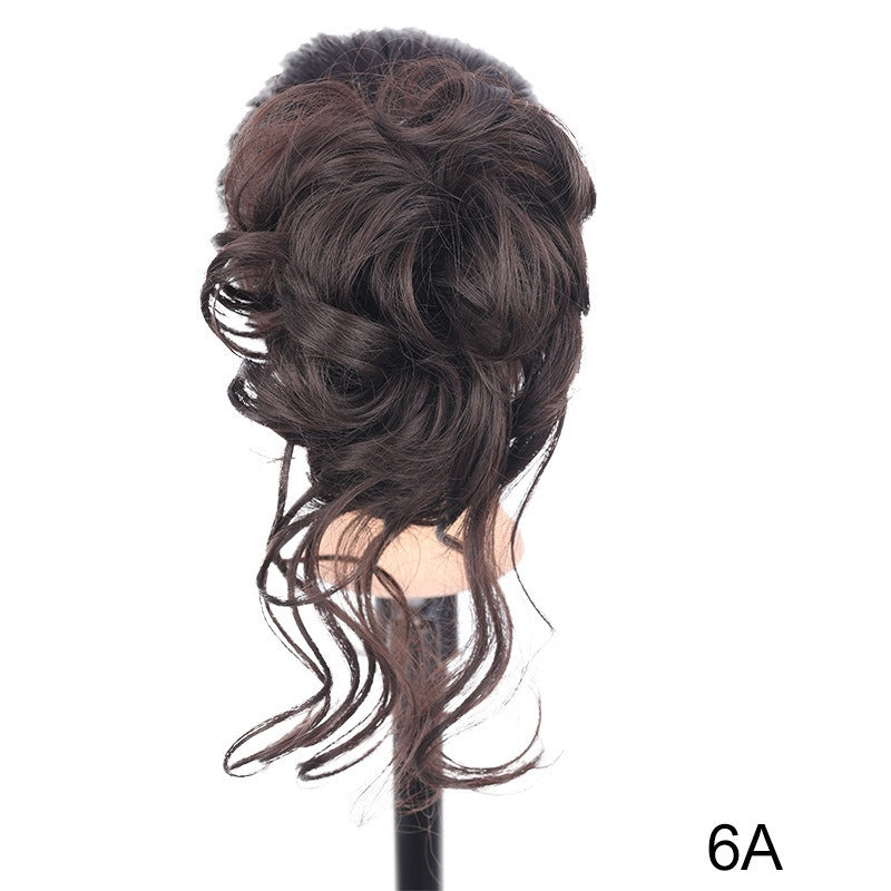 Chignon synthétique bouclé et ébouriffé sur pince (type « claw clip ») avec mèches pendantes – Postiche pour femme