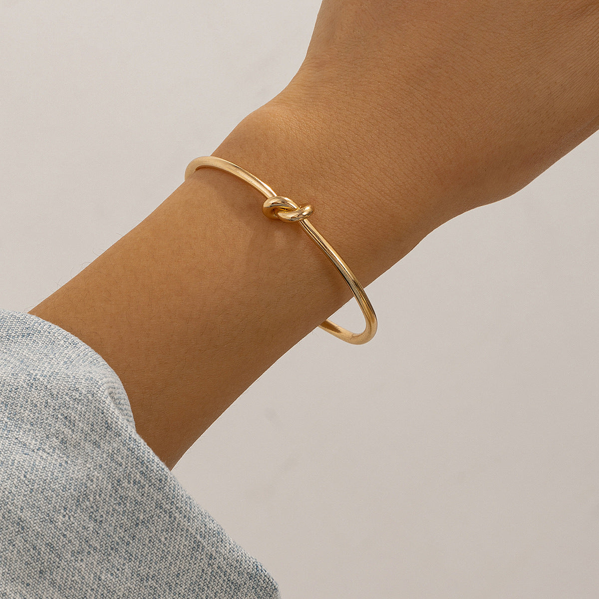 $7.22 USD - Double-row bracelet with hollow knot opening, trendy handmade accessory, ideal for women's daily wear.