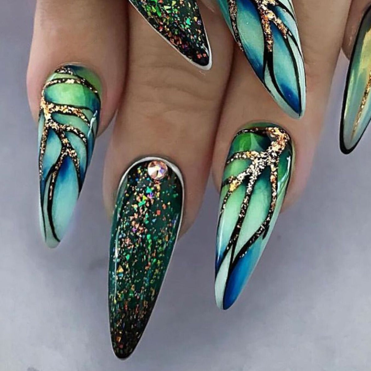 Almond manicure, natural look, trendy style, medium-length nails, patch effect.