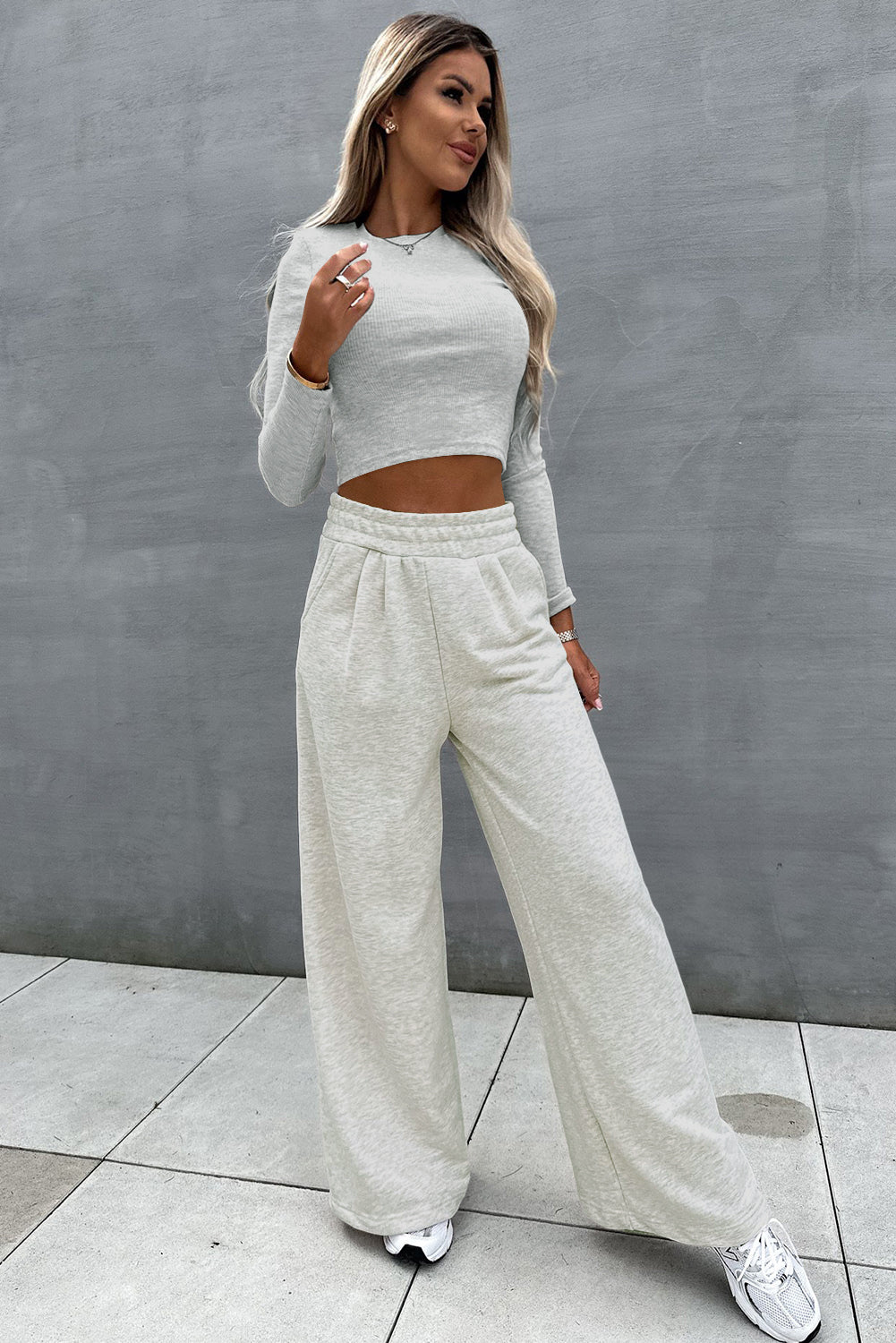 Two-piece set consisting of a black crop top and wide-leg trousers